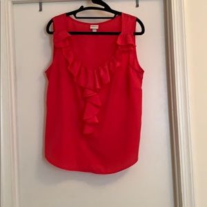Pink tank top with ruffle detail around neckline